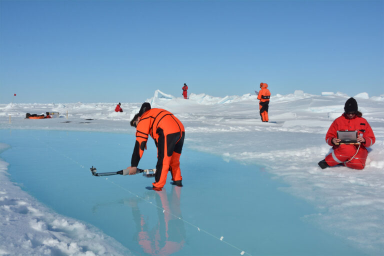 Marcel König and Natascha Oppelt (both from the University of Kiel, Germany) measuring melt pond optical properties during RV Polarstern campaign PASCAL, north of Svalbard in June 2017.