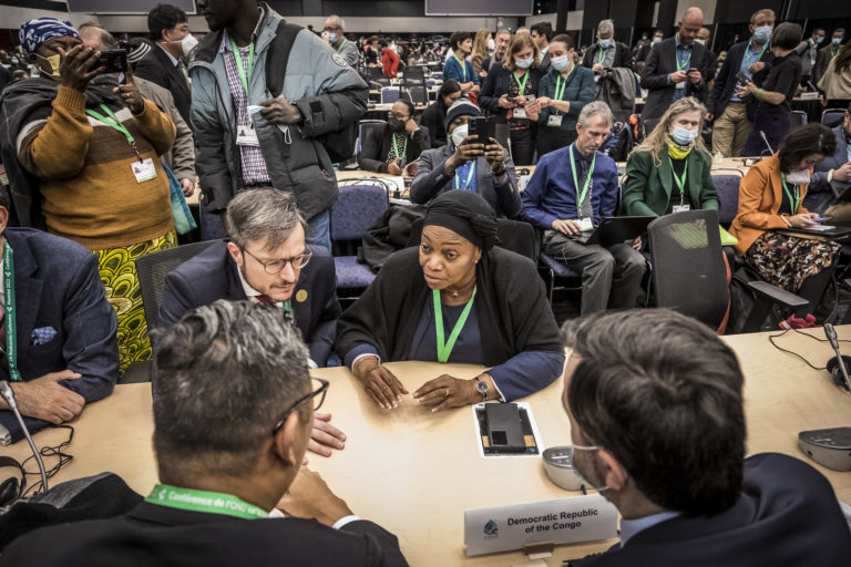 Negotiators speaking with DRC ministry of environment, Eve Bazaiba, during the closing plenary at COP15. Image by UN biodiversity via Flickr (CC BY-NC-ND 2.0).