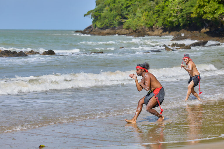 Goondoi rangers performing a traditional dance at Etty Bay Beach.