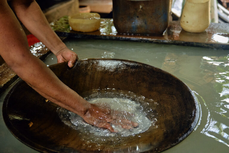 Small-scale miner using mercury while gold panning at an informal mine operation in Paracale, Camarines Norte, Philippines.