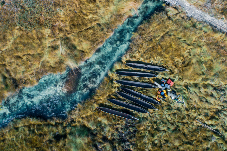 Aerial view of the NGOWP team's mekoro along the Cuando River.