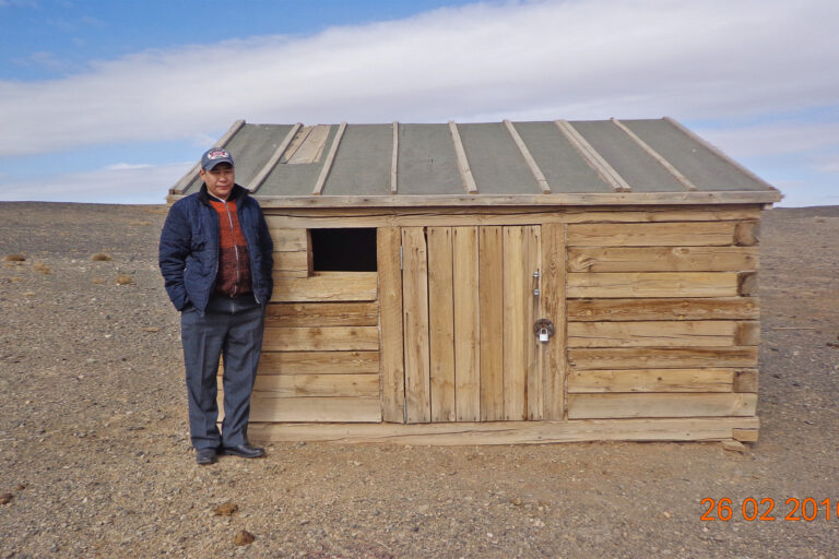 Battsengel Lkhamdoorov stands next to one of the summer quarters built by Oyu Tolgoi.