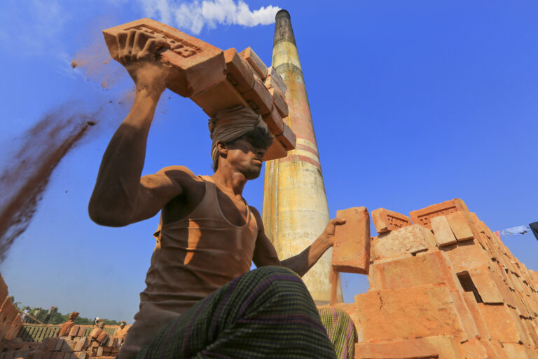 A laborer at a brickfield in Amin Bazar, Dhaka, Bangladesh.