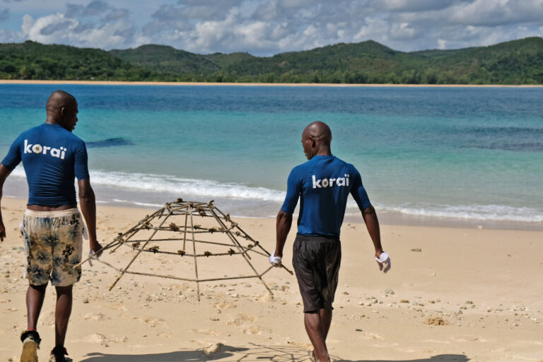 Koraï divers prepare to install a frame housing young hard corals in the protected waters of Antsoha Island, off northwestern Madagascar.