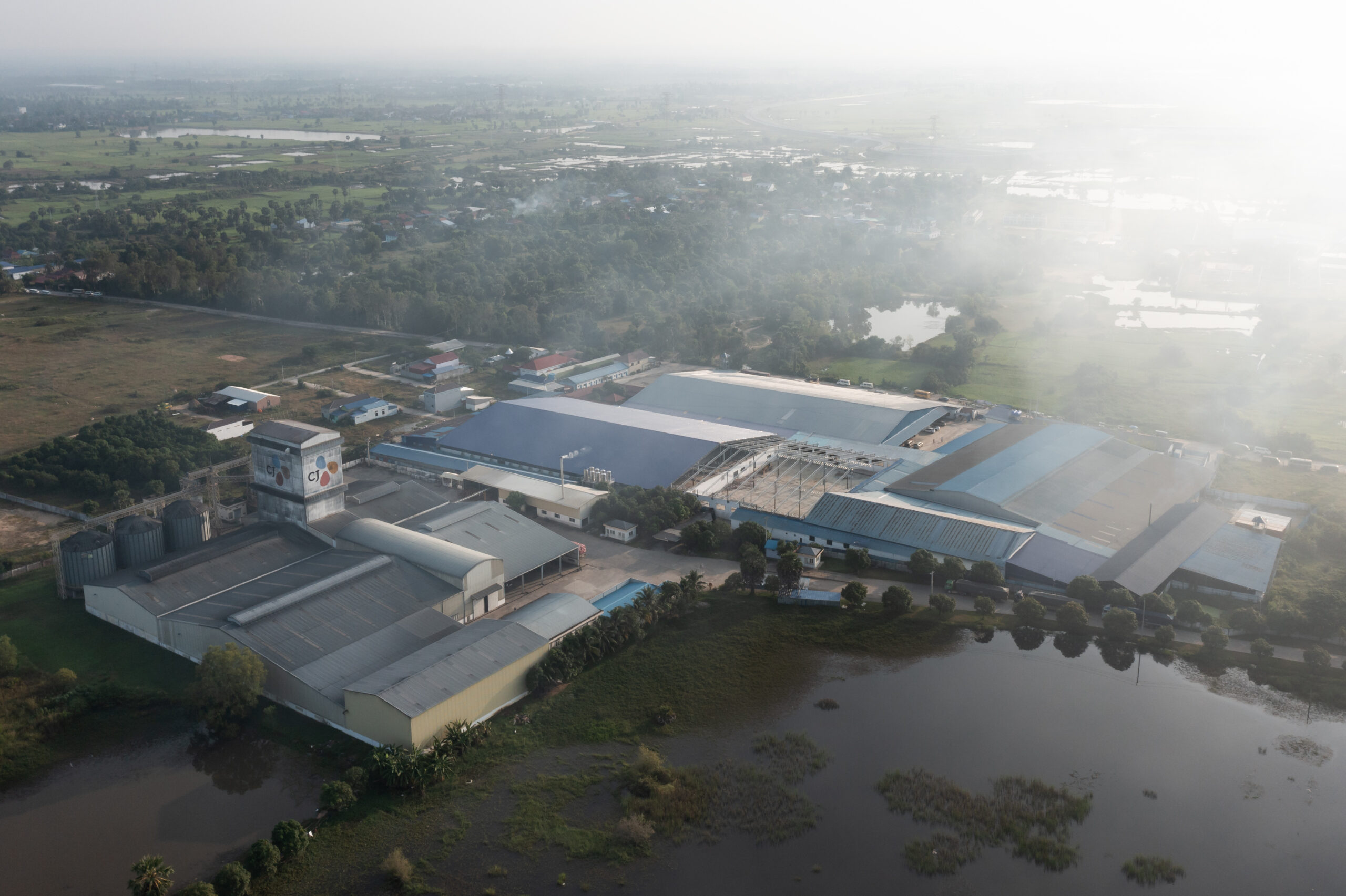 A cluster of garment factories in Kampong Speu Province, a hotspot for factories that cluster along National Road 4 that connects Phnom Penh to Sihanoukville. Credit: Andy Ball/Mongabay.