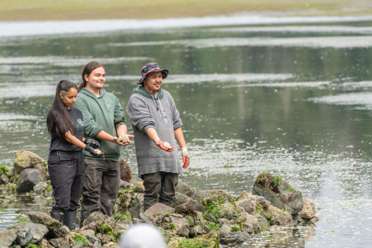 Gisele Martin, Hayden Seitcher, and Hughie Watts from Tseshaht nation — blessing the garden, carrying out a small ceremony to honor the land and ocean to ensure the garden's success and to respect their traditions.