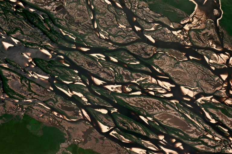 Planet satellite images of the confluence of the Rio Negro and Rio Jufari near the border of the states of Amazonas and Roraima in Brazil taken in October 2023, revealing sandbars and exposed riverbed during the severe drought that affected large parts of the Amazon rainforest. Photo courtesy of Planet Labs.