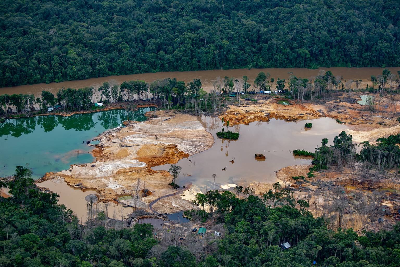 Overflight images in 2021 reveal the destruction wrought by illegal gold mining within the Yanomami Indigenous Territory in Roraima state.