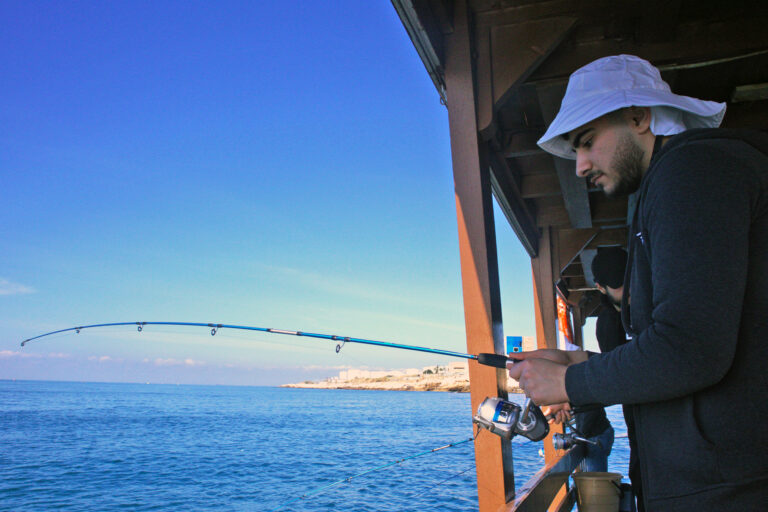 Trainee Ossam Bassam fishing at sea for the first time.