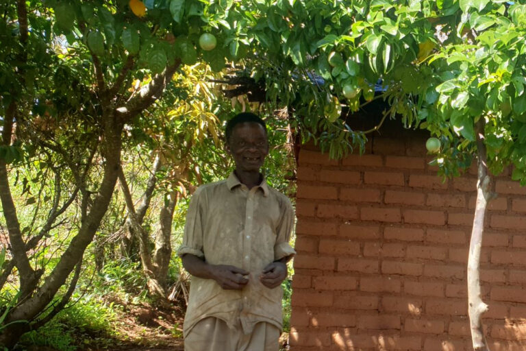 Peter Kamowa settled in the edge of the forest and helps to guard it from invasion. Image by Charles Mpaka for Mongabay.