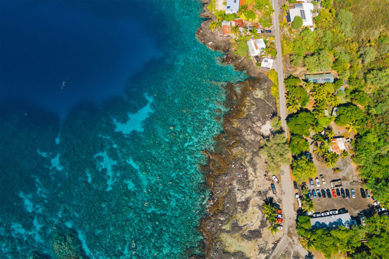 Coral reefs seen along the coast in an aerial photo.