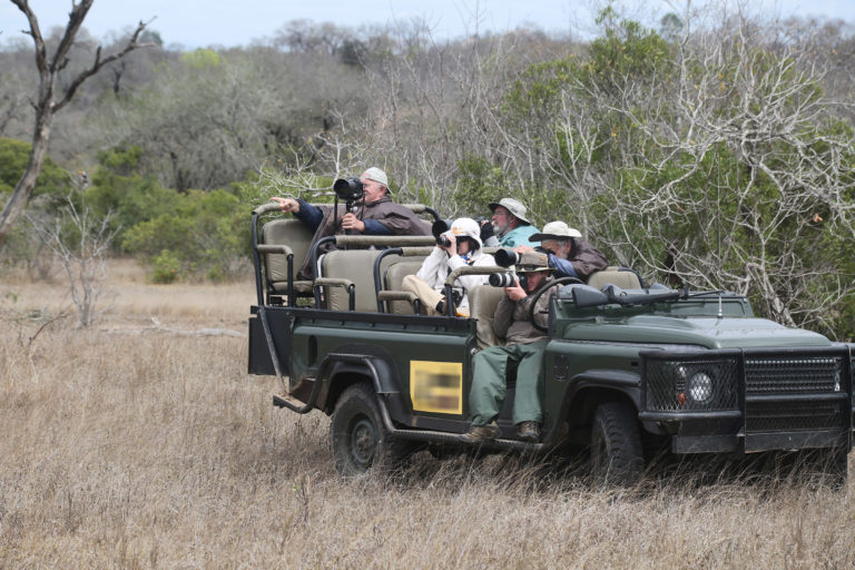 Tourists in South Africa's Kruger National Park photograph wildlife. Image by Rhett Butler for Mongabay.