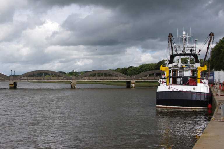 A trawler docked in a harbour in Scotland.