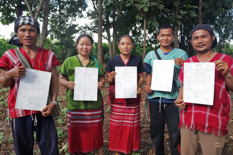 Some of the villagers with their land title certificates.