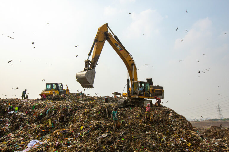 A excavator in a landfill in Bangladesh.